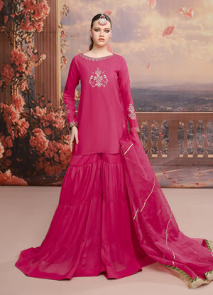 model wearing fuchsia pink organza dress buraqstore luxury outfit