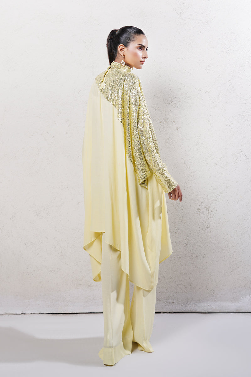 Woman wearing an elegant sequins net and Grip Georgette outfit from the Anayra Amal collection, featured at Buraq Store