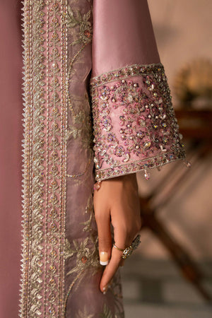 Woman posing in a stylish blush pink Elaris tissue silk 3 piece outfit from the Dastoor collection PK, featured at Buraq Store