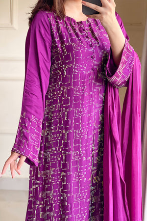 Woman posing in a deep plum 3 piece suit from Sidra Fahad official, featured at Buraq Store