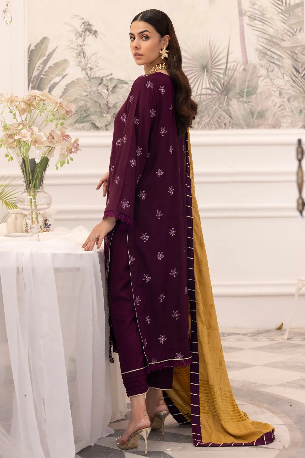 Girl wearing stylish maroon winter suit by buraqstore Pakistan