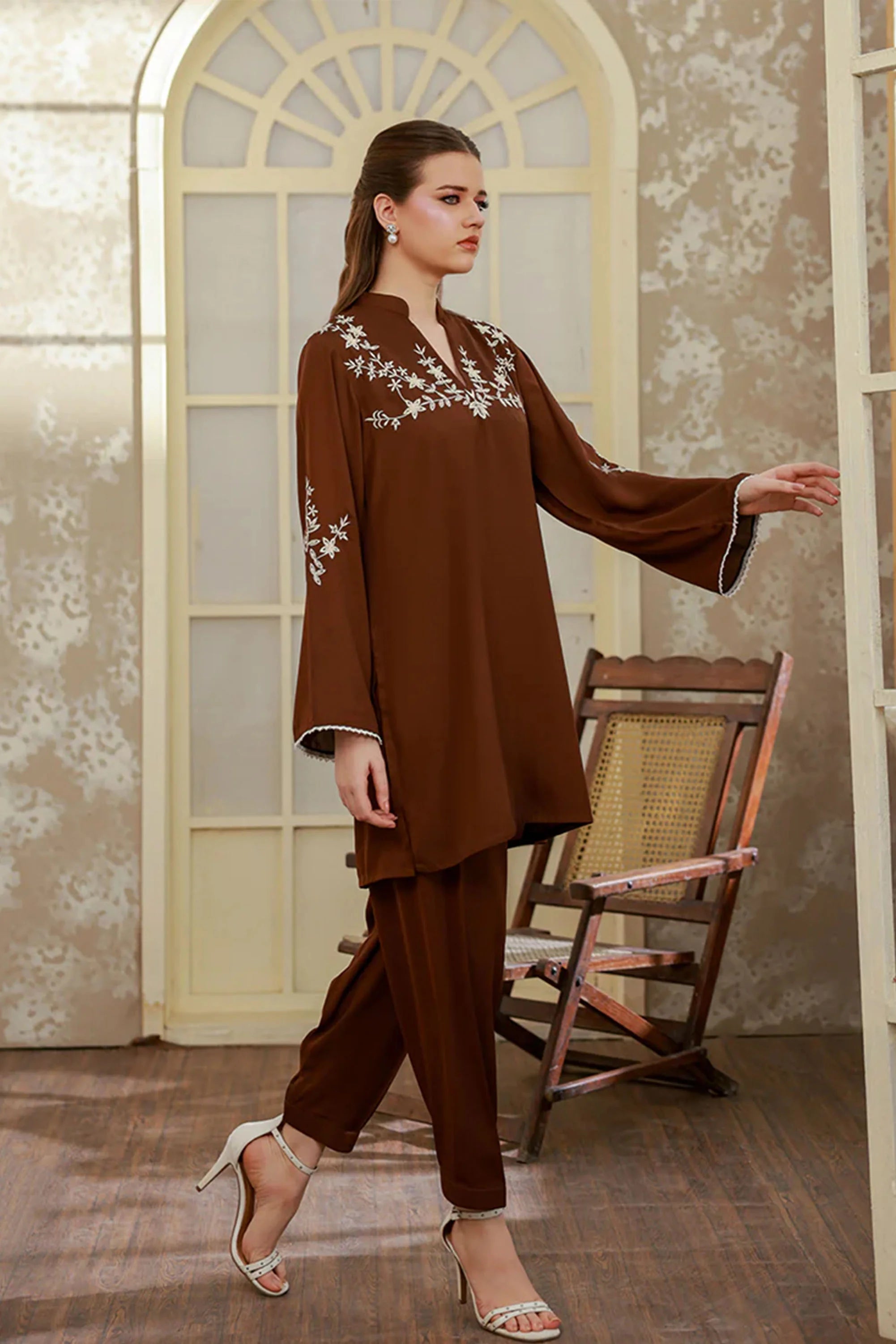 Girl wearing soft georgette dress by Buraqstore styled for evening wear