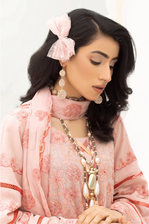 Girl dressed in classic karandi unstitched suit with warm texture and elegant detailing from Buraqstore