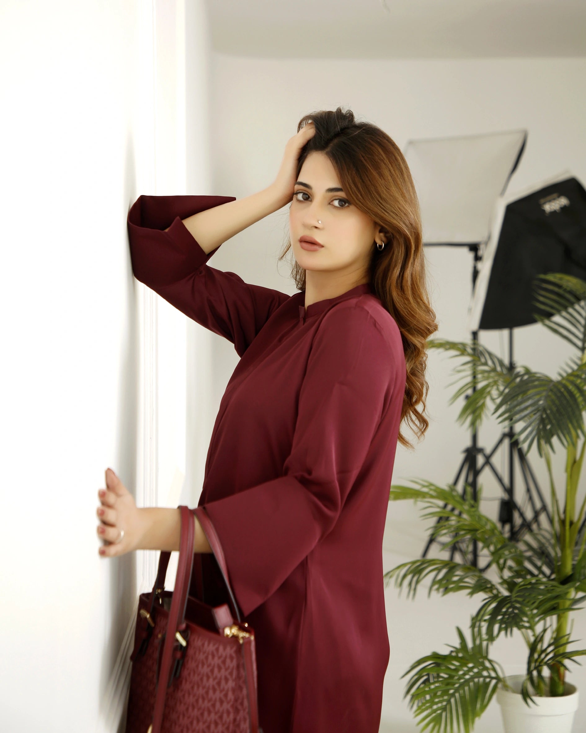 Girl wearing modern maroon dress for girls by buraqstore Pakistan