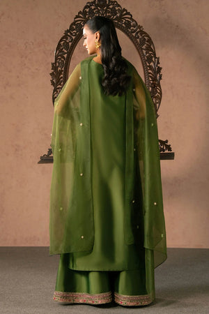 Woman posing in a stylish green Esma tissue silk 3 piece outfit from the Dastoor collection, featured at Buraq Store