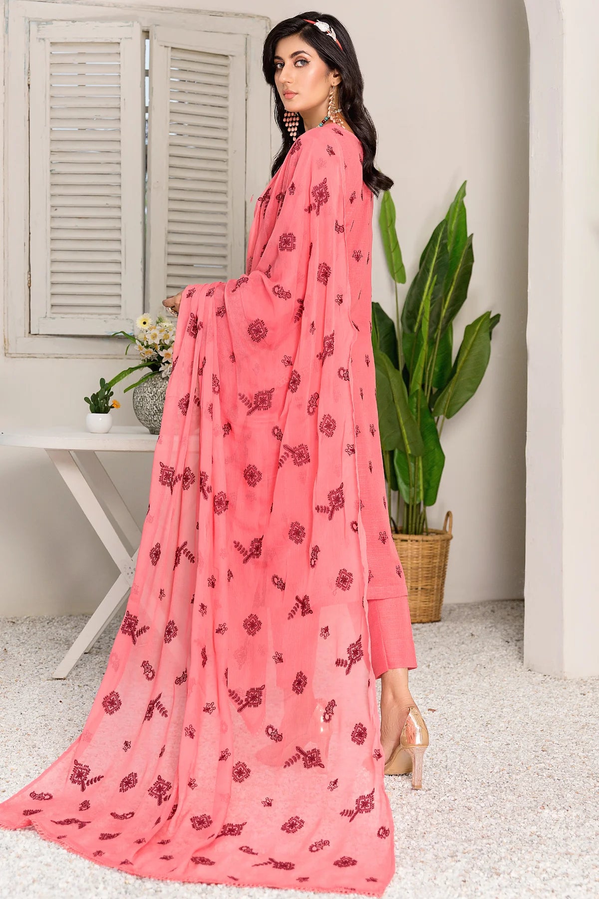 model posing in pink karandi suit unstitched buraqstore fashion