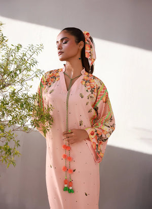 model posing in pink kaftan dress orange groove style buraqstore