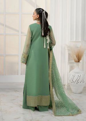 girl posing in emerald green dress by buraqstore formal wear