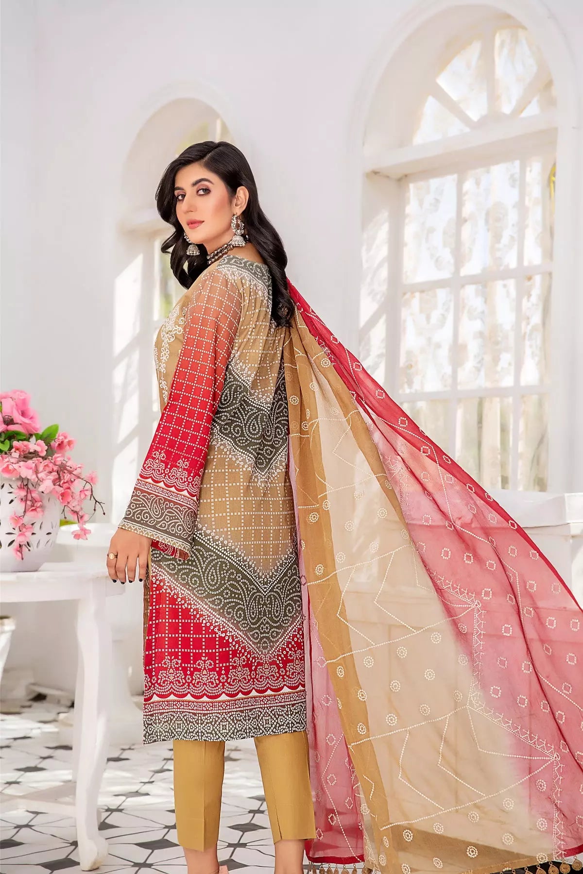 Buraqstore girl posing in floral red colour dress lawn outfit with fresh styling