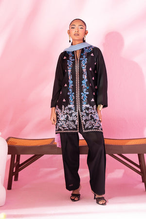 Woman posing in a sophisticated black 3 piece suit from Sidra Fahad official, featured at Buraq Store