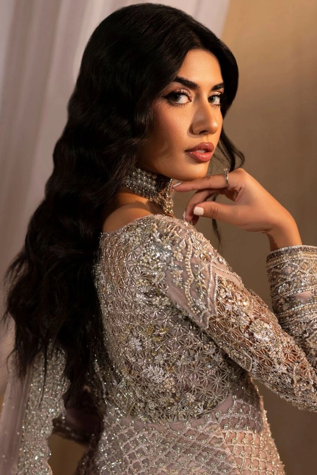Woman wearing a luxurious lilac lehnga choli from the Anayra Amal collection, featured at Buraq Store