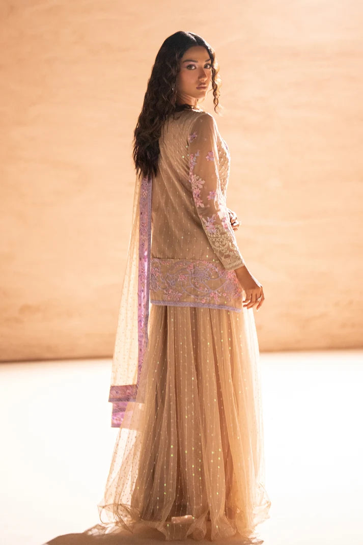 Women wearing beige net suit, close-up of dabka embroidery and pearl-sequins embellishment, Buraqstore