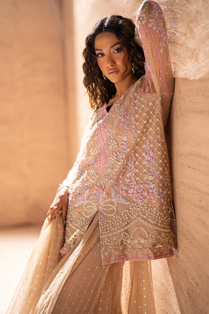 Women wearing beige net suit, back view of the handcrafted dabka embroidery on the net, Buraqstore