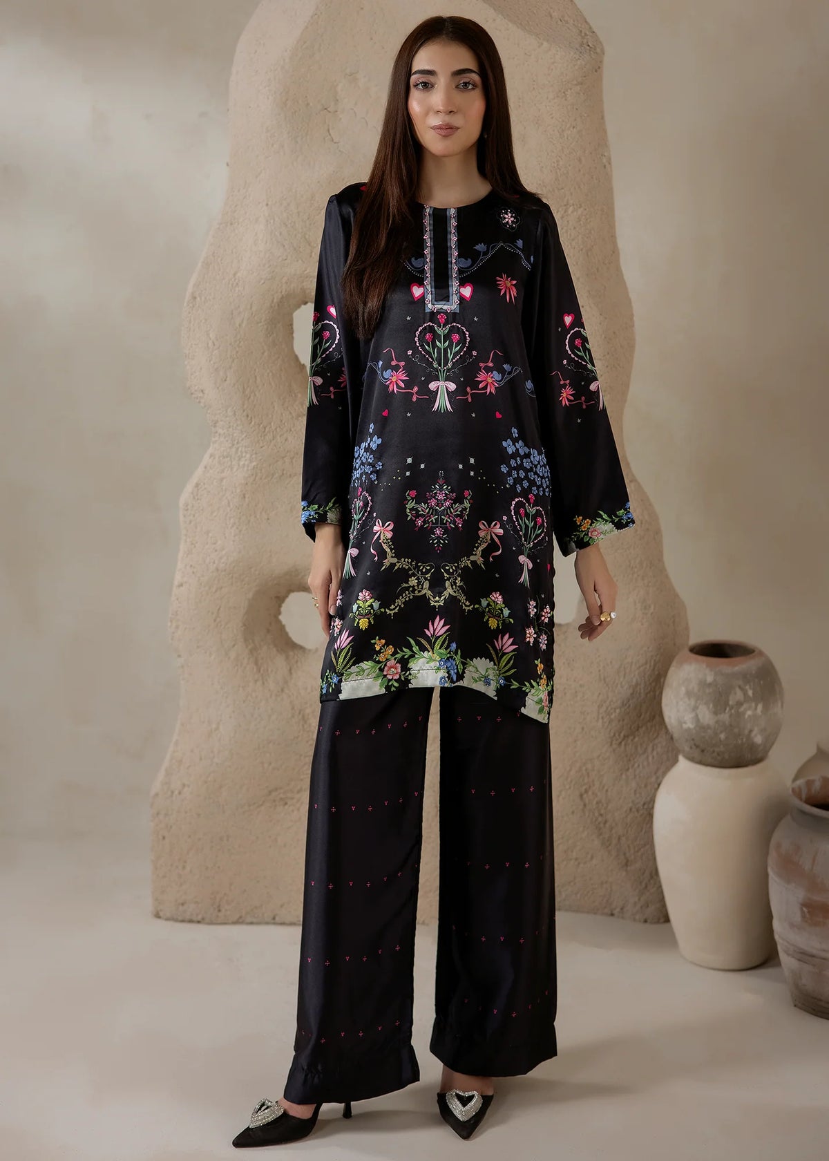 Model wearing black co ord set, a printed charmeuse silk top and bottom, front view from Buraqstore