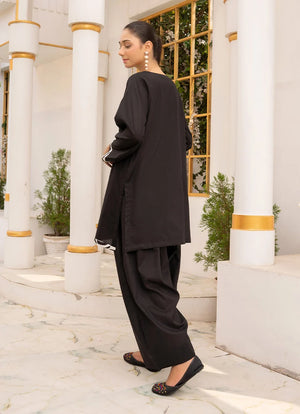Women wearing black co ord set, close-up of the dori and lace detail on the cotton top, Buraqstore