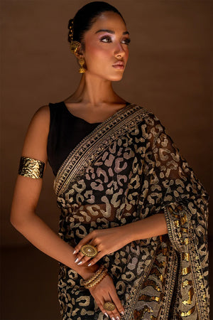 Women wearing black designer saree pakistan as an evening look, shop organza saree online at Buraqstore