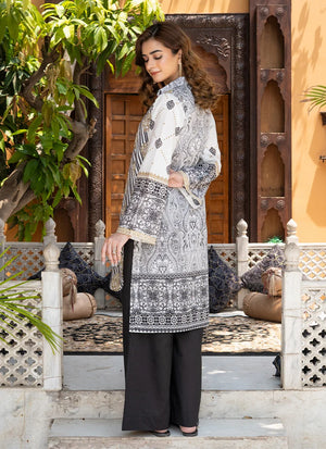 Women wearing black and white dress, close-up of the print on the lawn shirt, Buraqstore