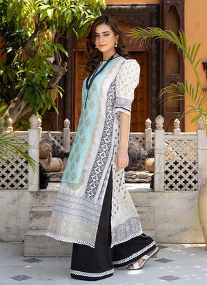 Model wearing black and white dress design, side view showing the fit of the printed lawn 2PC, Buraqstore