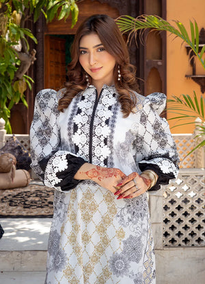 Model wearing black and white dress pakistani, side view showing the fit of the printed lawn 2PC, Buraqstore