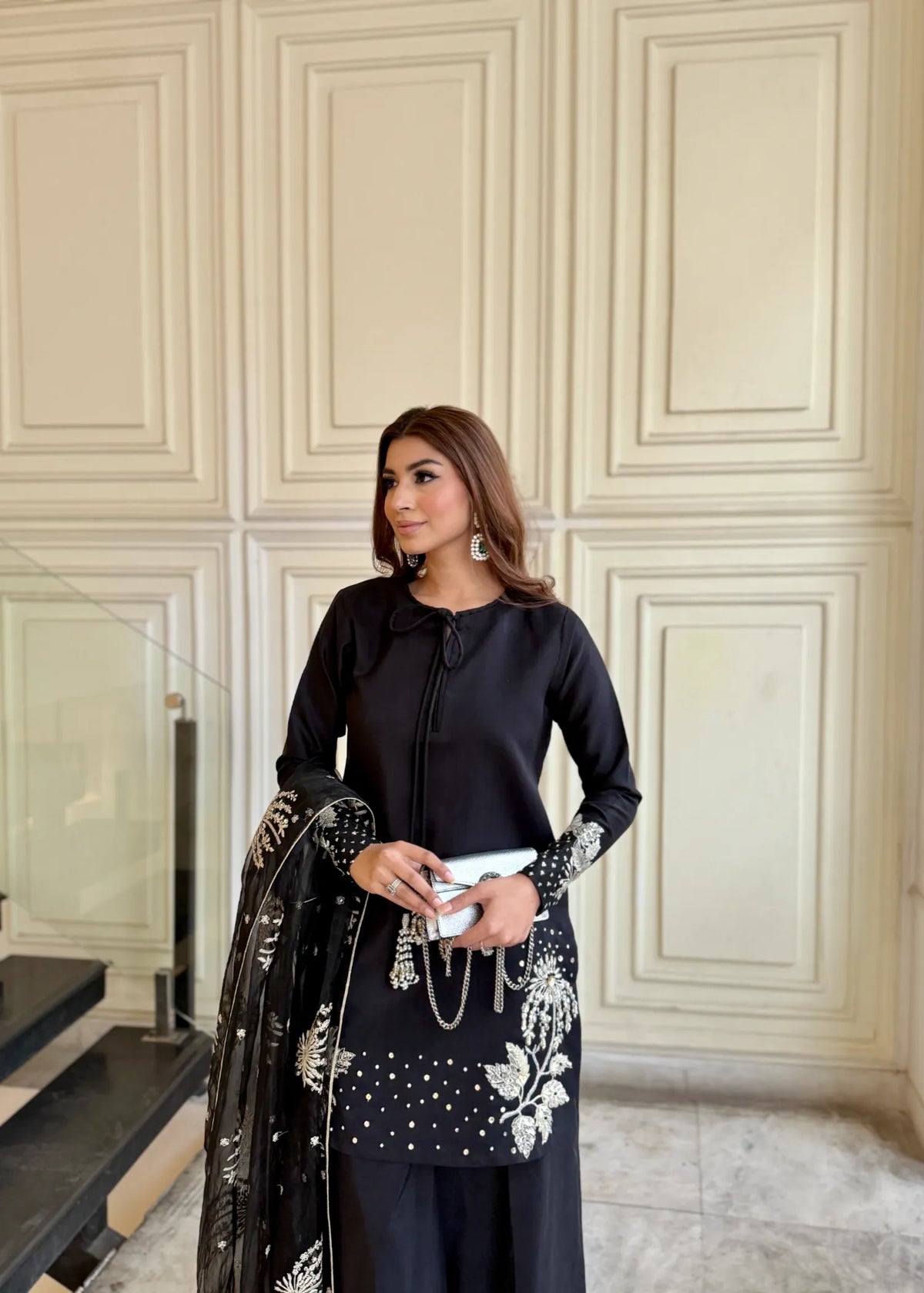 Model showcasing a black Jamnii silk 3 piece suit at Buraq Store