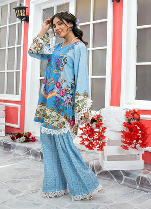Model wearing blue dress design, side view showing the fit of the printed lawn 2PC, Buraqstore