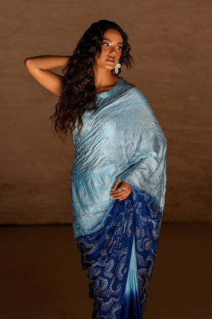 Model wearing blue silk saree price in pakistan set, soft pastel elegance blended with deep dramatic detailing, back view, Buraqstore