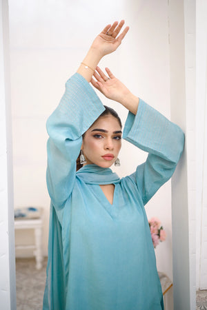 woman posing in blue velvet dress by Buraqstore formal evening wear