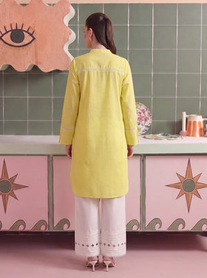 Model wearing buttercup dress, side view showing the fit of the shirt and trouser 2PC, Buraqstore