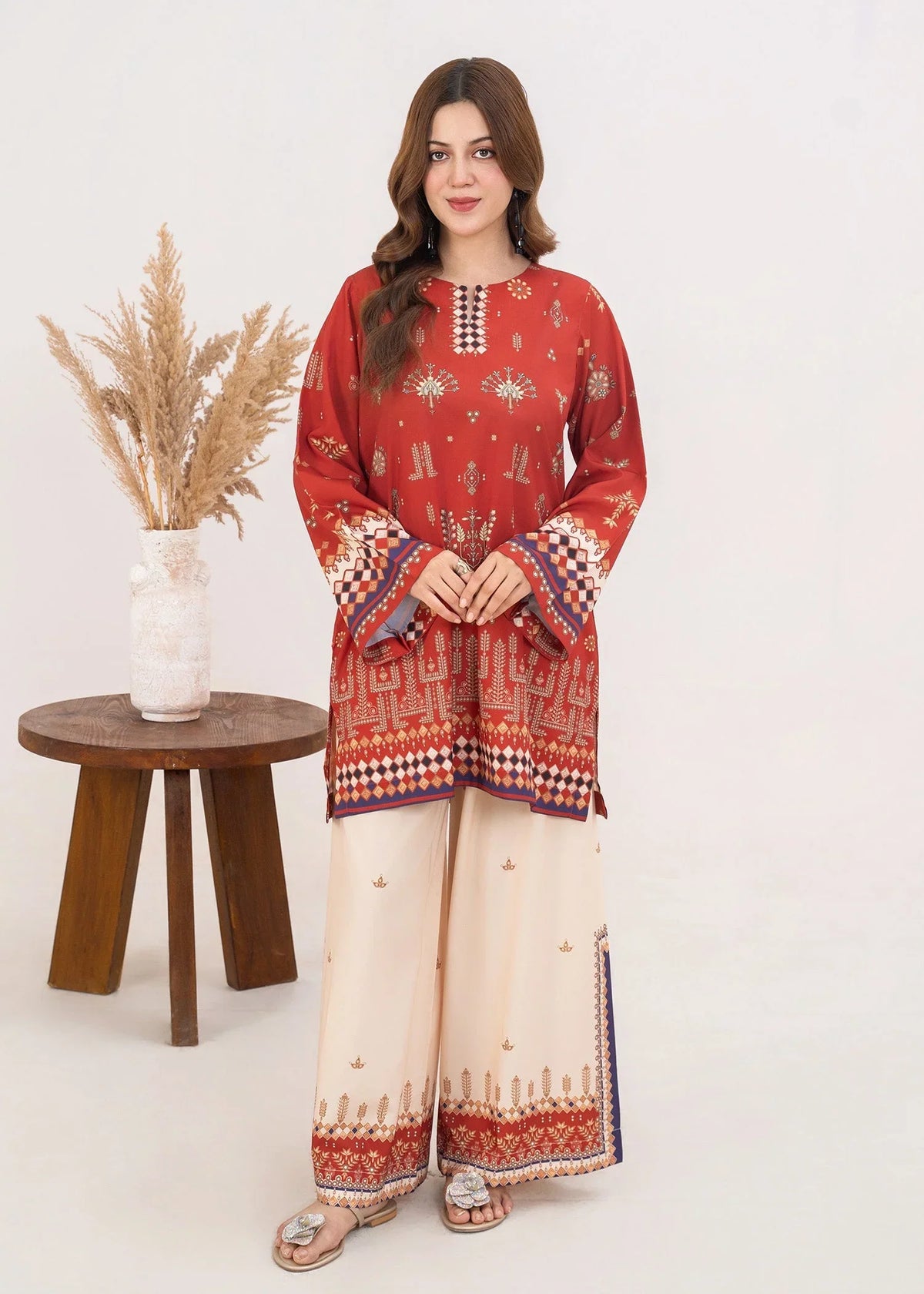 Model wearing orange colour dress in flame, printed poly lawn 2PC set, front view from Buraqstore