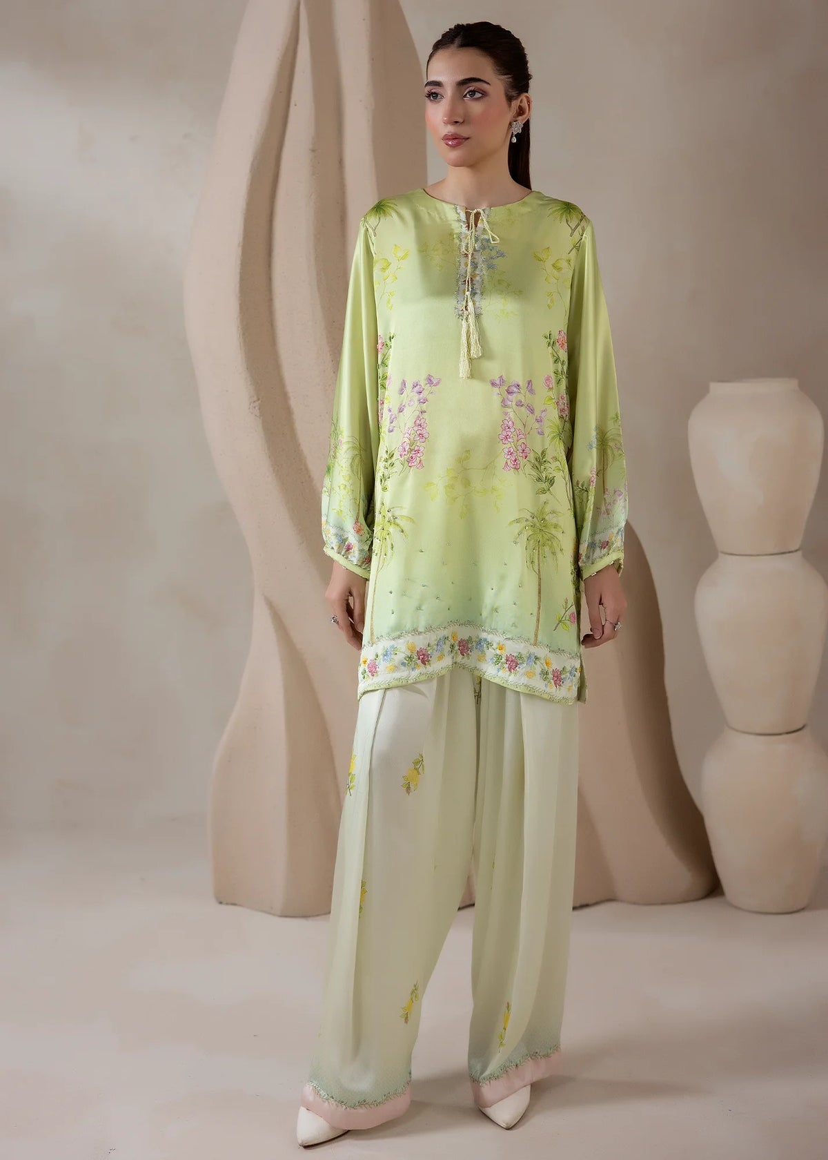 Model wearing co ord set design in green, a printed charmeuse silk top and bottom, front view from Buraqstore