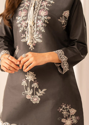 Model wearing grey colour dress, side view showing the fit of the embroidered lawn 2PC, Buraqstore