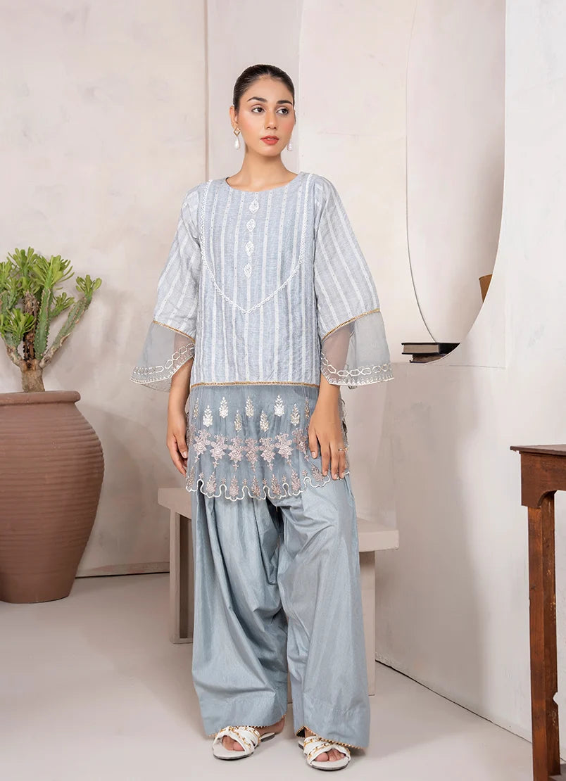 Model wearing grey colour dress, an embroidered jacquard shirt and bottom, front view from Buraqstore