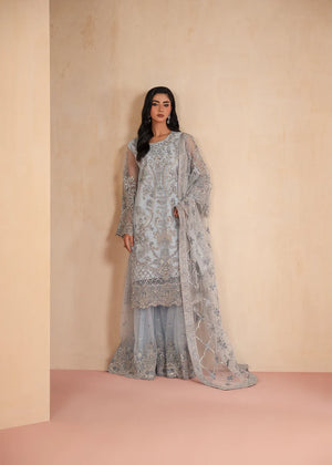 Model wearing ice blue color dress, an embroidered and embellished shirt with gharara, front view from Buraqstore