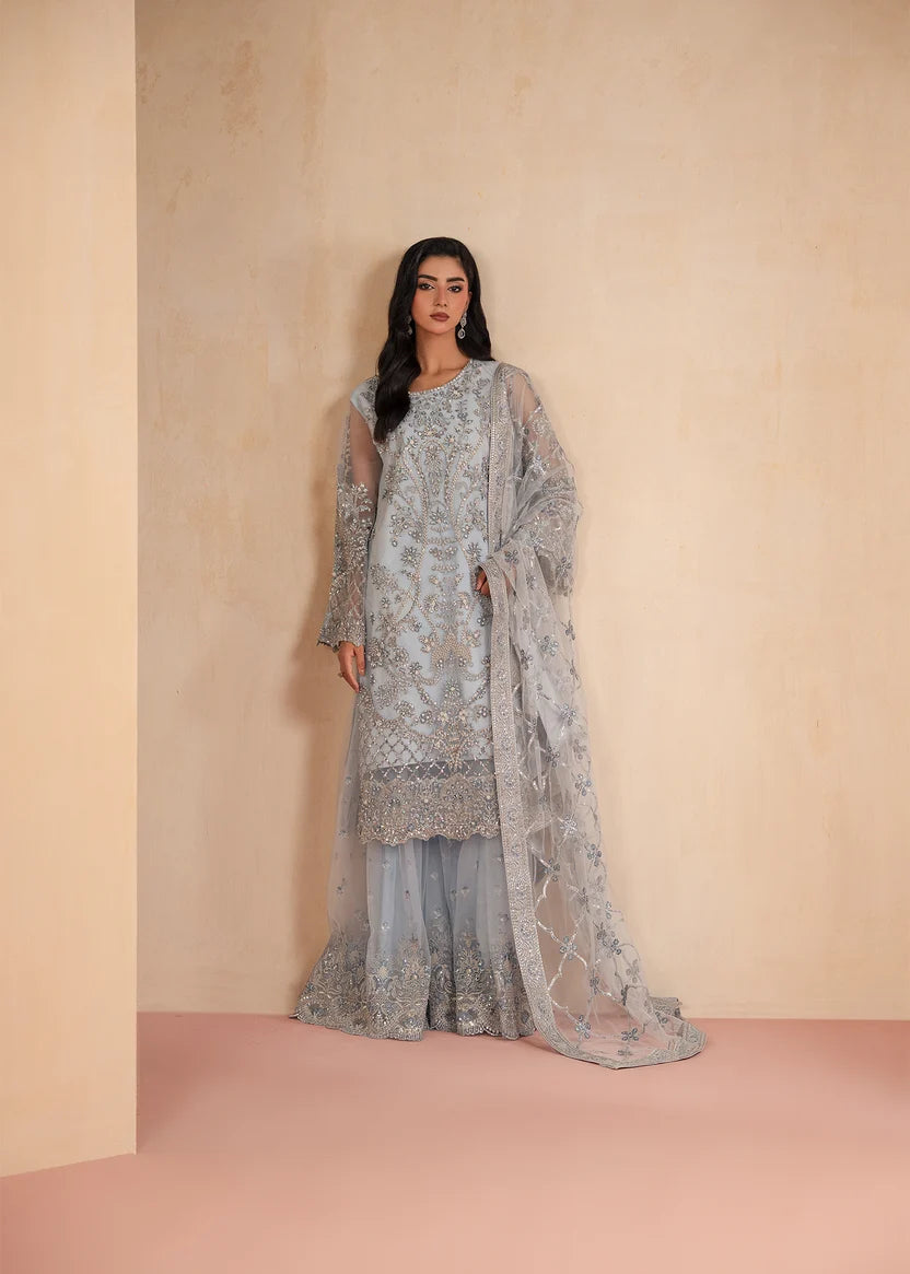 Model wearing ice blue color dress, an embroidered and embellished shirt with gharara, front view from Buraqstore