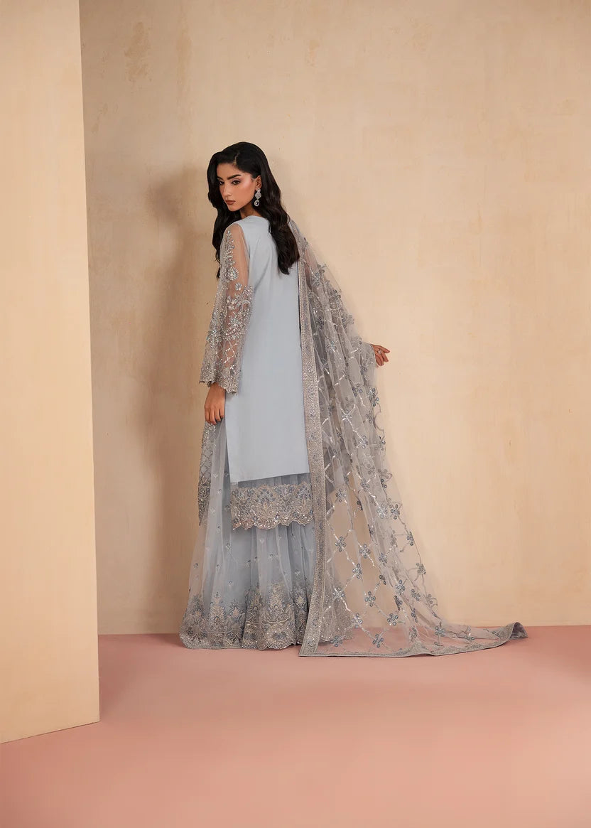 Woman wearing ice blue color dress, close-up of the embroidery and embellishment on the shirt, Buraqstore