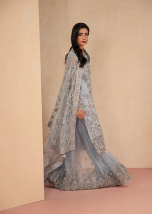 Model wearing ice blue color dress as a fresh festive outfit, shop the embroidered gharara 3-piece set at Buraqstore