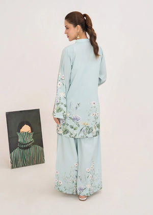 Women wearing ice blue summer co ord sets Pakistan in a relaxed standing pose, printed poly lawn 2-piece at Buraqstore