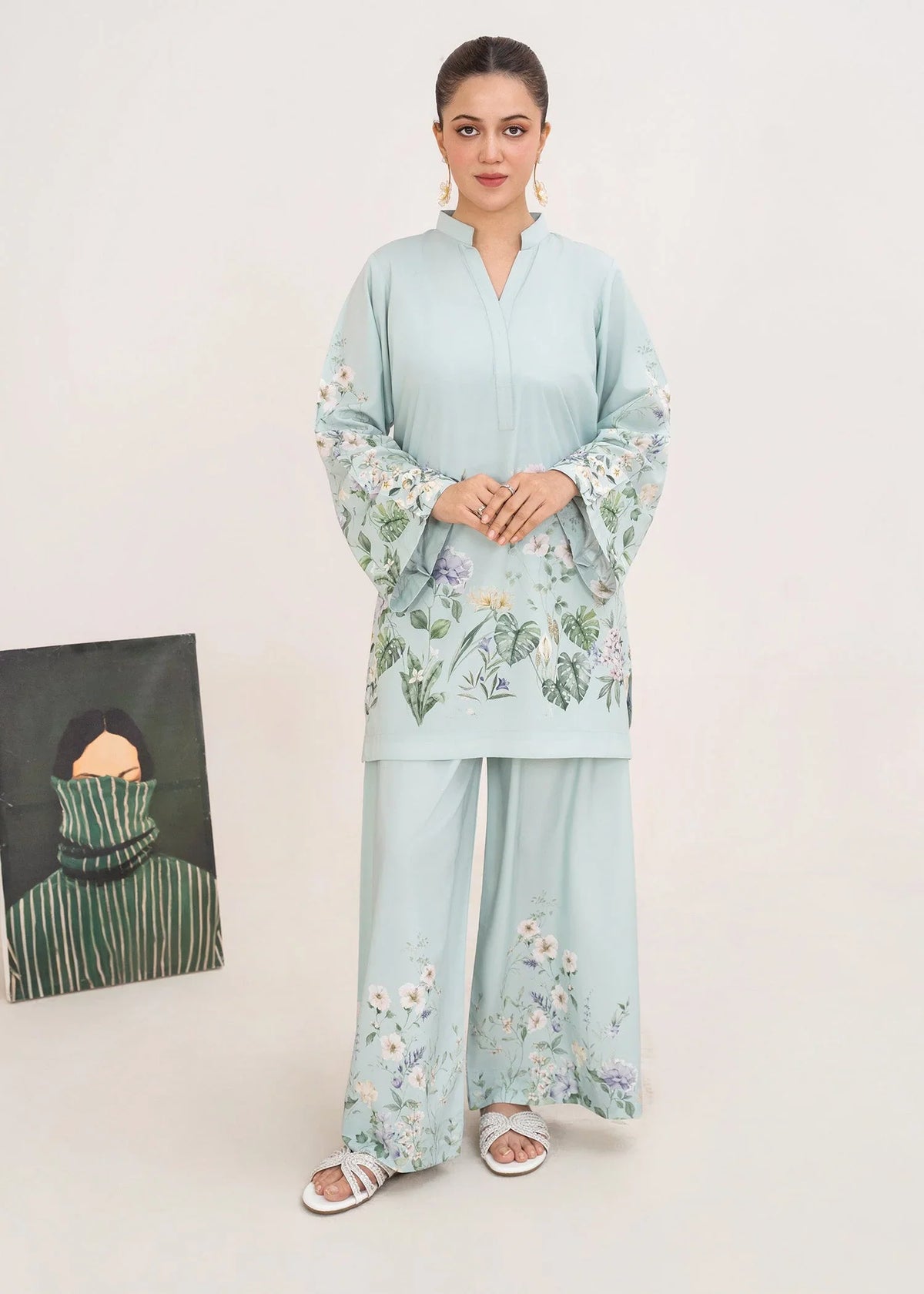 Model wearing ice blue summer co ord sets Pakistan, printed 2-piece poly lawn set, front view from Buraqstore