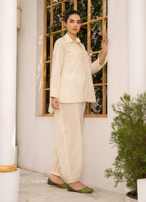 Women wearing co ord sets, close-up of the dori and lace detail on the cotton top, Buraqstore