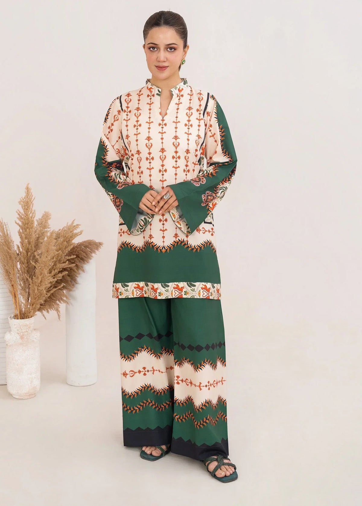 Model wearing silk dress design in ivory and green, printed silk 2PC set, front view from Buraqstore
