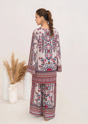 Model wearing ivory lawn co ord sets Pakistan in a relaxed standing pose, printed poly lawn 2-piece at Buraqstore