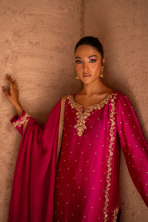 Model wearing magenta pink sheesha silk suit as a festive outfit, shop handcrafted 3PC silk set online at Buraqstore