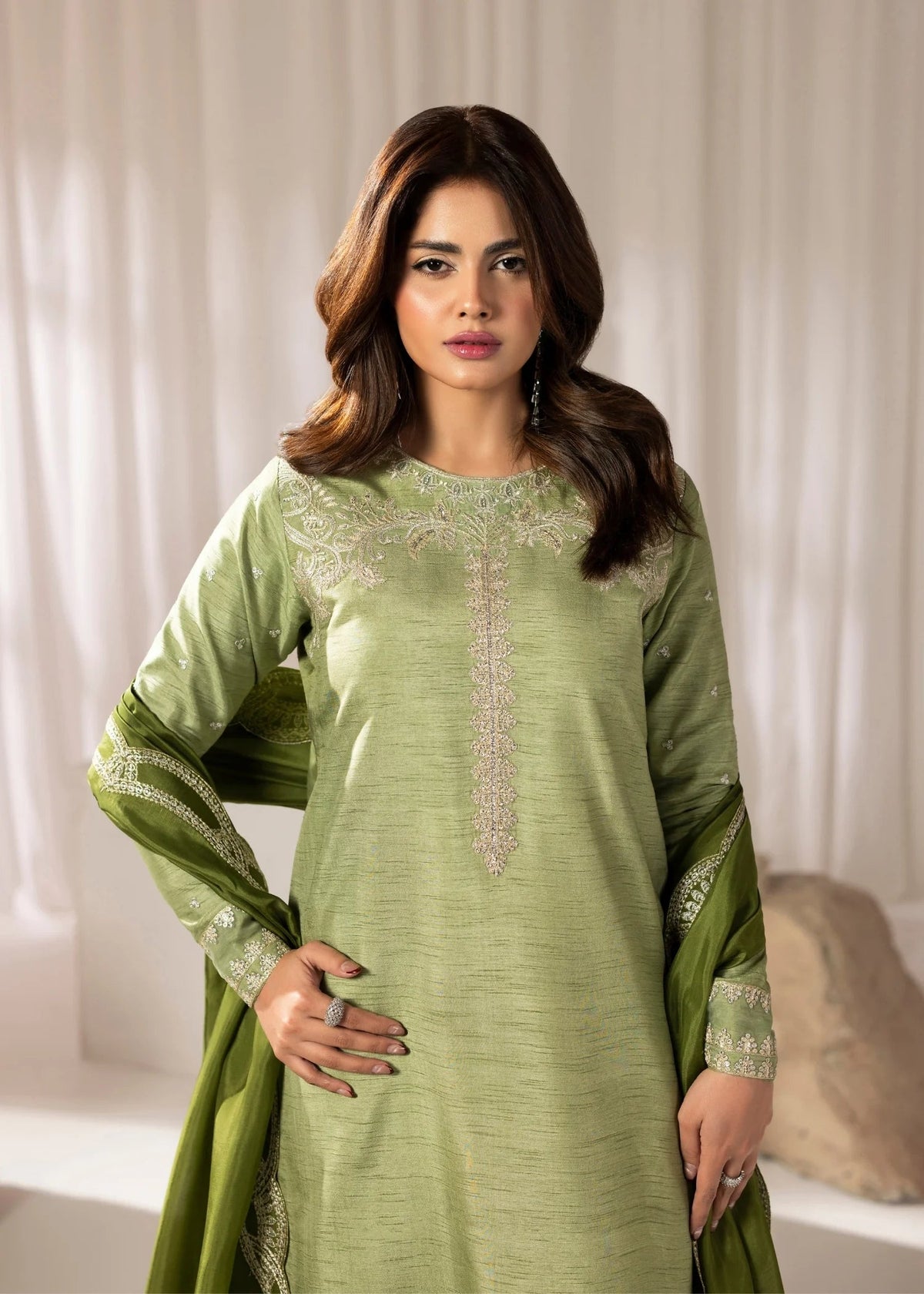 Model showcasing a mint green Jamnii Korean silk 3 piece suit at Buraq Store