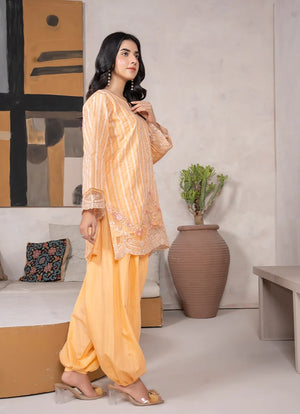 Model wearing yellow dress for women, side view showing the fit of the jacquard 2-piece set, Buraqstore