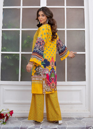Model wearing yellow dress for women, side view showing the fit of the printed lawn 2PC, Buraqstore