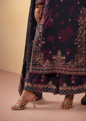 Model wearing navy blue dress pakistani, side view showing the flow of the chiffon shirt and trouser, Buraqstore