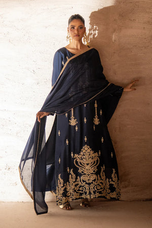 Model wearing navy blue sheesha silk dress price in pakistan set, panel detailing on the shirt and trouser, side view at Buraqstore