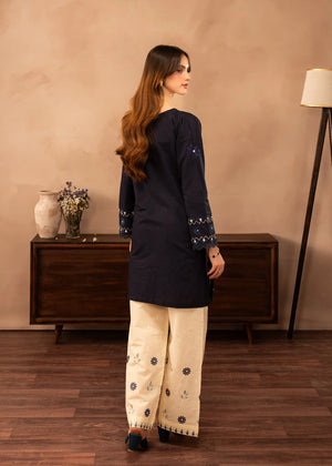 Women wearing navy blue dress pakistani, close-up of the embroidery on the white lawn shirt, Buraqstore
