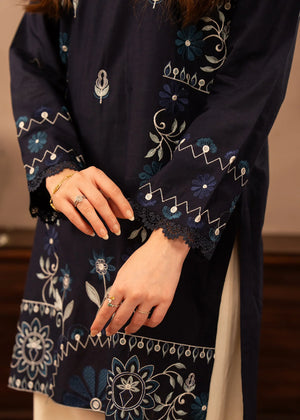 Model wearing navy blue dress pakistani, side view showing the fit of the embroidered lawn 2PC, Buraqstore