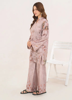 Model wearing orchid pink lawn co ord set as a light casual outfit, shop printed poly lawn 2-piece at Buraqstore